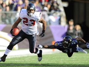 Houston Texans running back Arian Foster (left) eludes Baltimore Ravens cornerback Lardarius Webb during their AFC Divisional playoff game on Sunday. (Reuters)