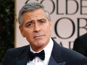 Actor and director George Clooney arrives at the 69th annual Golden Globe Awards in Beverly Hills, California January 15, 2012.  REUTERS/Mario Anzuoni