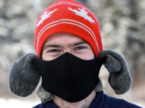 Carl Chandler wrapped a pair of mittens over his ears to give them some extra protection against Edmonton's frigid temperatures, while ice skating at Hawrelak Park Sunday 15, 2012. Daytime temperatures hovered around -20, but the windchill made it feel like -30. DAVID BLOOM EDMONTON SUN
