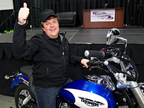 Kevin Baker won a new bike at the Edmonton Motorcycle Show on Sunday. AMBER BRACKEN / Edmonton Sun