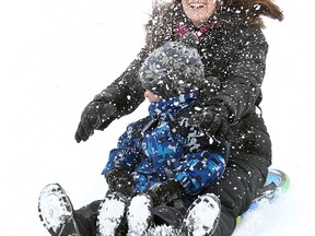 Jennifer Busch and her four year old son Tyler get hit with flying snow while sledding on a hill on Wellington Crescent  in Winnipeg Saturday January 07, 2012.
BRIAN DONOGH/WINNIPEG SUN/QMI AGENCY
