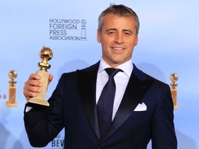 Matt LeBlanc holds his award for best performance by an actor in a television series - comedy or musical, for "Episodes," backstage at the 69th annual Golden Globe Awards in Beverly Hills, California, January 15, 2012. REUTERS/Lucy Nicholson