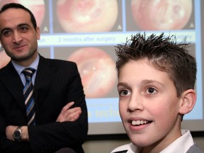 A new surgical technique to repair a perforated eardrum, demonstrated by Dr. Issam Saliba, takes only 20 minutes. He is seen here with one of his patients, Benjamin Cotin. (Stephen Laberge/QMI AGENCY)