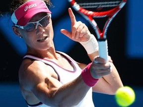 Samantha Stosur hits a return to Sorana Cirstea during their women's singles match at the Australian Open in Melbourne on Tuesday, Jan. 17, 2012. (REUTERS/Tim Wimborne)