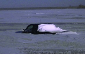 A truck went through the ice on the Red River near Selkirk on Wednesday night, said RCMP. This photo is from last year, when a truck went through thin ice on Lake Winnipeg. (Handout pic)