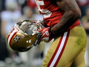 49ers tight end Vernon Davis breaks into tears after scoring the game-winning touchdown against the Saints during their NFC divisional playoff game against at Candlestick Park in San Francisco, Calif., Jan. 14, 2012. (THEARON W. HENDERSON/Getty Images/AFP)