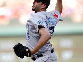Toronto Blue Jays Carlos Villanueva pitches against the Texas Rangers in the first inning of their MLB American League baseball game in Arlington, Texas July 23, 2011. (REUTERS/Mike Stone)