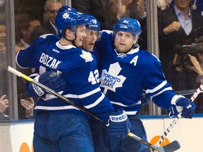 Maple Leafs' Tyler Bozak (left) and Phil Kessel (right) congratulate Joffrey Lupul on his goal against the Senators in the first period on Tuesday. (Fred Thornhill/REUTERS)