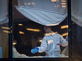 Investigators and cleanup crews on the scene after a shooting at  a Downtown restaurant inside the Wall Centre in Vancouver, British Columbia, Wednesday January 18, 2012. (CARMINE MARINELLI/QMI AGENCY)