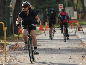 Cyclists make their way along the Assiniboine Avenue bikeway in Winnipeg Sunday, Oct. 10, 2010. (MARCEL CRETAIN/QMI Agency)