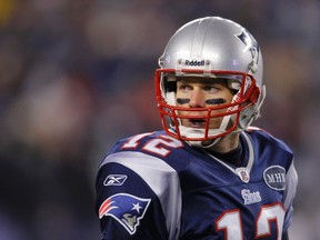 New England Patriots quarterback Tom Brady watches during a play in the third quarter of the NFL AFC Divisional playoff game against the Denver Broncos in Foxborough, Massachusetts, Jan. 14, 2012. (REUTERS/Brian Snyder)