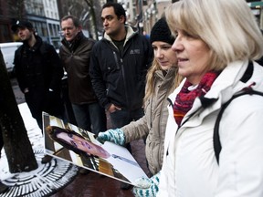 (centre left) Rachael Huszar holds a picture of her missing brother Matthew as her mom (right) Danny Huszar looks at the photo during a press conference in Vancouver Wednesday January 18, 2012. Matthew Huszar went missing Dec. 16. (CARMINE MARINELLI/QMI AGENCY)