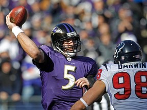 Baltimore Ravens quarterback Joe Flacco  passes under pressure from Houston Texans outside linebacker Connor Barwin during their AFC divisional playoff  game in Baltimore Sunday. (REUTERS)