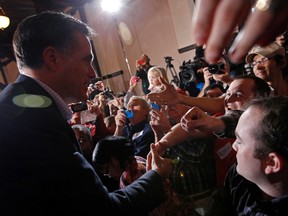 U.S. Republican presidential candidate and former Massachusetts Governor Mitt Romney greets supporters at a campaign rally at Winthrop University in Rock Hill, South Carolina January 18, 2012. (REUTERS/Jim Young)