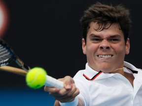 Milos Raonic hits a return to Philipp Petzschner during their second-round match at the Australian Open in Melbourne, Australia, Jan. 19, 2012. (DARREN WHITESIDE/Reuters)