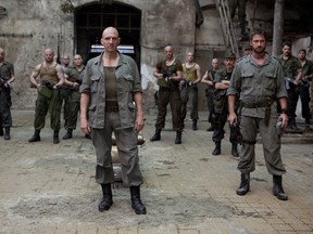 Ralph Fiennes (centre) directs and stars in Coriolanus.
