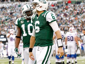 Santonio Holmes appears to be giving Jets quarterback Mark Sanchez an earful during a game earlier this season.  (GETTY IMAGES)