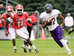 Wilfrid Laurier receiver Shamawd Chambers out-runs his York Lions pursuers during an OUA game earlier this year. (ADAM GAGNON/ Laurier Athletics)