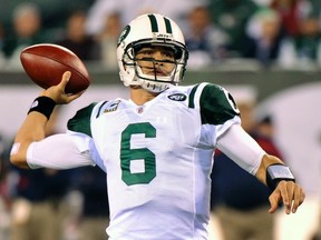 Jets quarterback Mark Sanchez looks to pass against the Patriots at New Meadowlands Stadium in East Rutherford, N.J., Nov. 13, 2011. (RAY STUBBLEBINE/Reuters)