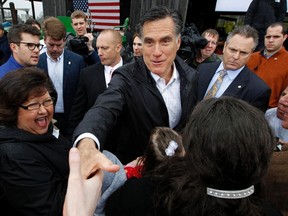 U.S. Republican presidential candidate Mitt Romney greets supporters during a campaign rally in Gilbert, South Carolina on January 20, 2012. (REUTERS/Jim Young)