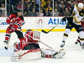 Bruins forward Gregory Campbell scores on Devils goaltender Martin Brodeur at the Prudential Center in Newark, N.J., Jan. 19, 2012. (RAY STUBBLEBINE/Reuters)