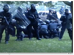 A shot from a video of Adam Nobody's arrest by police at the G20 Summit in Toronto in June 2010. (Toronto Sun files)