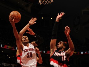 Leandro Barbosa of the Toronto Raptors goes to the basket against LaMarcus Aldridge of the Portland Trail Blazers Friday night at the Air Canada Centre.(AFP)