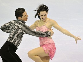 Tessa Virtue (R) and Scott Moir skate during the dance short program at the Canadian figure skating championships in Moncton on Friday.
(REUTERS/ Mike Cassese)