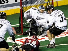 Edmonton's Aaron Bold stops Colorado's Jordan McBride during Friday's game at Rexall Place. (Codie McLachlan, Edmonton Sun)