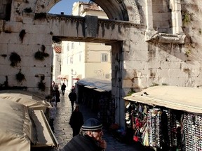 A banner "We shall all be bought", referring to Croatia's EU entry, hangs over the entrance to an ancient Roman palace in the southern Croatian city of Split January 17, 2012. (REUTERS/Matko Biljak)