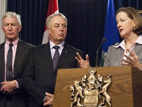 Alberta Premier Alison Redford, along with government ministers Doug Horner, Cal Dallas (middle) and Ted Morton (left), responded to the U.S. government's decision to reject the current application for the approval of the Keystone X.L. pipeline at the Alberta Legislature in Edmonton, Alberta, on Jan. 18, 2012. The pipeline was slated to run through Alberta to U.S. gulf coast refineries. IAN KUCERAK/EDMONTON SUN QMI AGENCY
