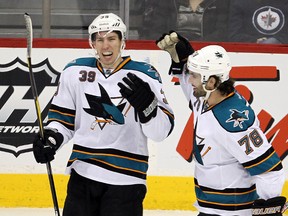 San Jose Sharks center Logan Couture, left, celebrates a second period goal against the Winnipeg Jets with right winger Benn Ferriero at the MTS Centre on Jan. 12.
Brian Donogh, QMI Agency