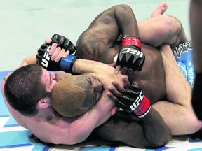 Jim Miller secures a rear choke submission to defeat Melvin Guillard during the UFC on FX 1 event at the Bridgestone Arena in Nashville, Tenn., on Friday night. (Zuffa LLC via Getty Images)