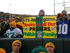 Fans show their support for Green Bay Packers offensive coordinator Joe Philbin, whose son drowned on Jan. 8. The Miami Dolphins hired Philbin as their head coach this past week. (REUTERS)