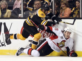 Bruins' Nathan Horton nails Ottawa's Zach Smith, one of the few hits the Boston forward has thrown this year. (US PRESSWIRE)