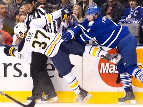 Toronto Maple Leafs' Cody Franson  takes out Buffalo Sabres' Matt Ellis along the boards during a game earlier this month. (REUTERS)