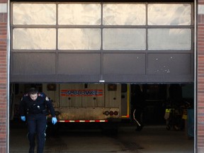 An EMT walks out of the Emergency bay as the door closes at the University of Alberta (U of A ) Hospital at 8440 112 St., in Edmonton on Wednesday January 19, 2012.  TOM BRAID/EDMONTON SUN QMI AGENCY