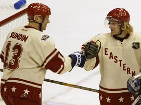 Senators captain Daniel Alfredsson shown getting congratulations from Toronto's Mats Sundin during the 2004 all-star game.