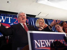 Republican U.S. presidential candidate and former U.S. House Speaker Newt Gingrich is accompanied by his wife Callista (2nd from R) and his granddaughter Maggie (R) as he addresses supporters at his South Carolina primary election night rally in Columbia, South Carolina, January 21, 2012.  (REUTERS/Eric Thayer)