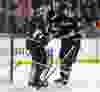 Anaheim Ducks defenseman Sheldon Brookbank (21) celebrates with goalie Jonas Hiller (1), of Switzerland after defeating the Ottawa Senators in their NHL hockey game 2-1 in Anaheim, California January 21, 2012. REUTERS/Alex Gallardo  (UNITED STATES - Tags: SPORT ICE HOCKEY)