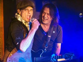 Singer David Lee Roth performs with Eddie Van Halen (R) during a private Valen Halen show to announce their upcoming tour at Cafe Wha? in New York January 5, 2012. REUTERS/Lucas Jackson
