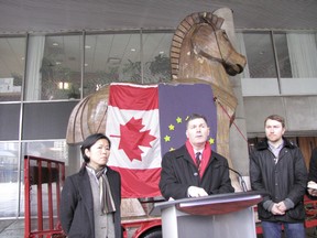 Councillor Glenn De Baeremaeker (centre) and Councillor Kristyn Wong-Tam (left) speak to reporters in front of a 14-foot tall Trojan Horse to Toronto City Hall on Monday, January 23, 2012. The councillors are demanding a permanent exemption of the City of Toronto from the Canada-European Union Comprehensive Economic and Trade Agreement (CETA). De Baeremaeker's motion goes to the executive committee Tuesday. (DON PEAT/Toronto Sun)