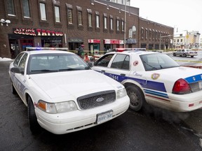 Ottawa Police Service guard the scene where 24 year old Navid Niran was murdered in  January 2012. (ERROL MCGIHON/THE OTTAWA SUN/QMI AGENCY).