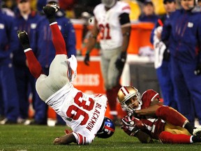49ers wide receiver Kyle Williams makes a catch in front of Giants defensive back Will Blackmon on a punt return in San Francisco last night. (Reuters)