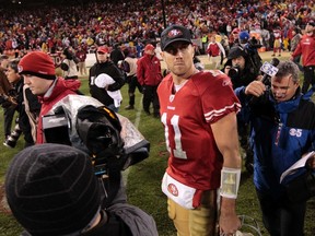 49ers quarterback Alex Smith walks off the field after losing to the Giants. (REUTERS)