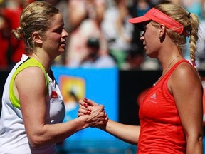 Kim Clijsters (left) shakes hands with Caroline Wozniacki after their women's singles quarterfinal match at the Australian Open in Melbourne on Tuesday, Jan. 24, 2012. (REUTERS/Daniel Munoz)