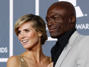Model Heidi Klum and husband singer Seal pose on arrival at the 53rd annual Grammy Awards in Los Angeles, California in this February 13, 2011 file photo. Supermodel and "Project Runway" TV host Klum and British singer Seal are separating after seven years of marriage, a parting the pair termed amicable in a statement on January 22, 2012 night.  REUTERS/Danny Moloshok/Files