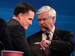 Republican presidential candidates Mitt Romney and Newt Gingrich (R) talk following the end of the Republican presidential candidates debate in Myrtle Beach, South Carolina on January 16, 2012. (REUTERS/Charles Dharapak/POOL)