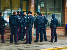 Police at the scene of a homicide at Cut Creator in Malvern Town Centre in the Scarborough area of Toronto on Tuesday January 24, 2012.  (Ernest Doroszuk /QMI AGENCY)
