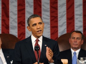U.S. President Barack Obama (C) delivers his State of the Union address to a joint session of Congress, as Vice President Joe Biden (L) and House Speaker John Boehner (R-OH) look on, on Capitol Hill in Washington, January 24, 2012. (REUTERS/Saul Loeb/Pool)